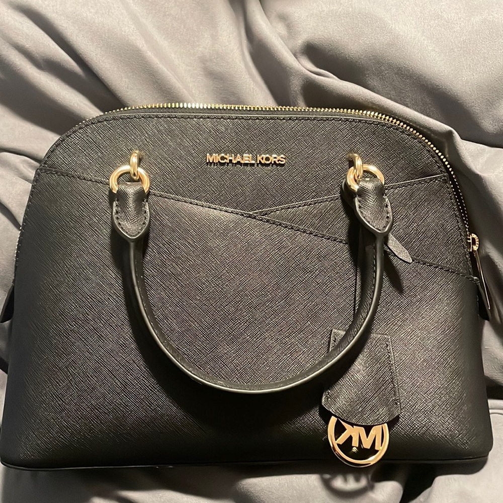 This is a once used Micheal Kors  bag that I do not use and would love to sell